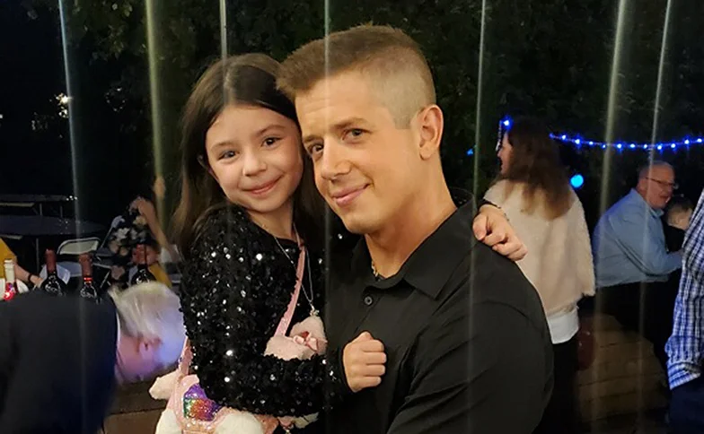 Ian Krohmer playing with kids