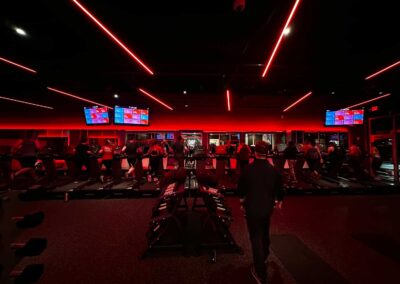 Members exercising in red light therapy