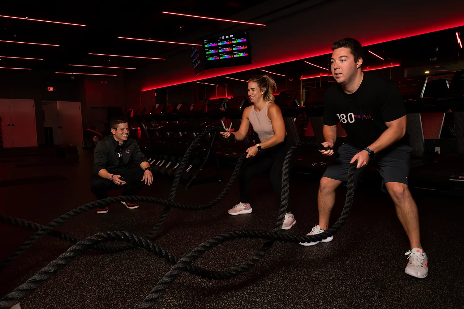 Members exercising in red light therapy